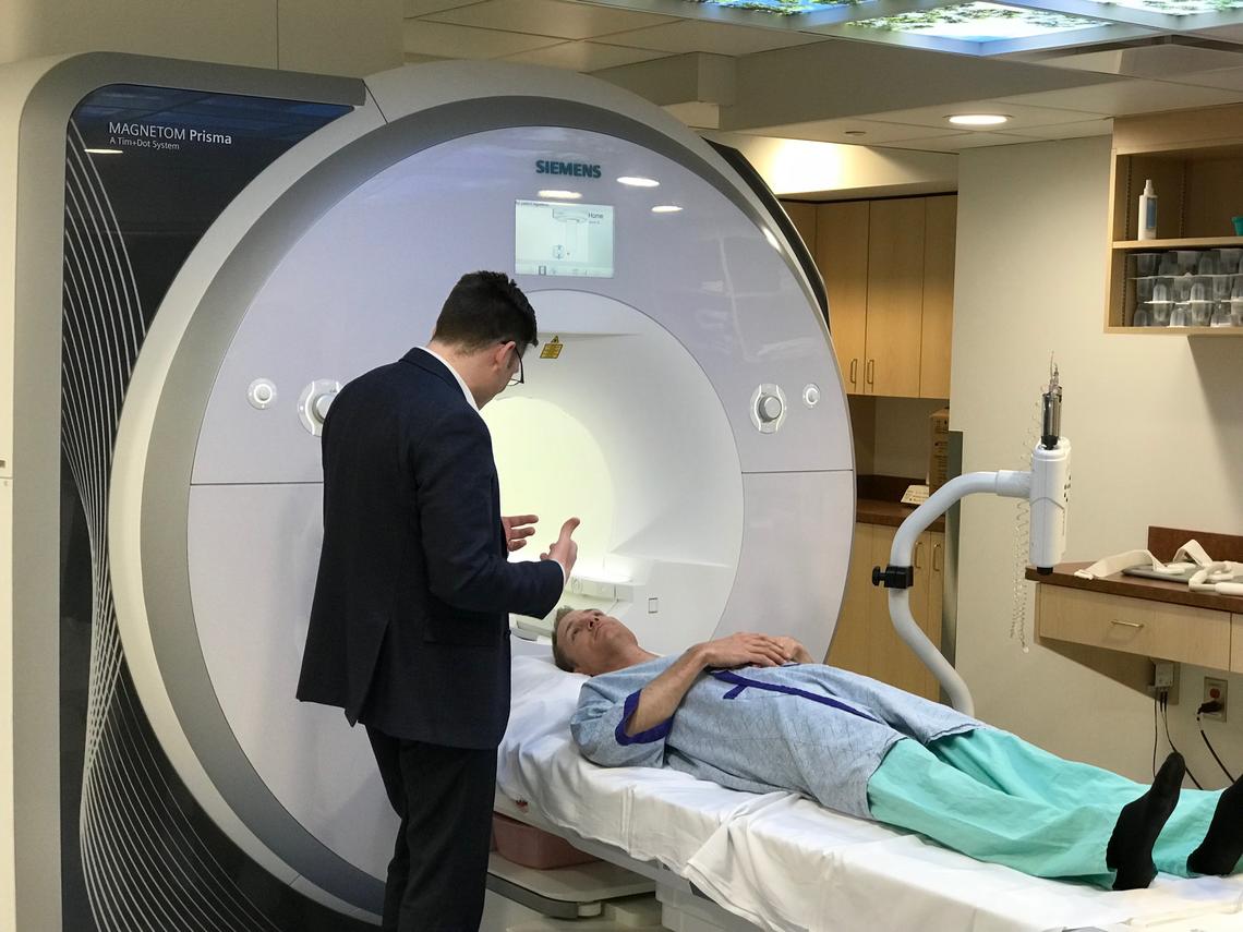 James White, director of the Stephenson Advanced Cardiac Imaging Centre, speaks to Dave Proctor as he prepares for an examination in the cardiac MRI.  