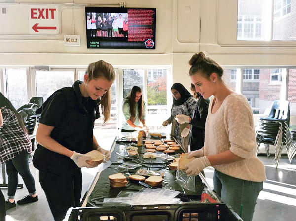 The Compassion, Connection, and Community club at Western Canada High School makes sandwiches for Calgary’s homeless community.