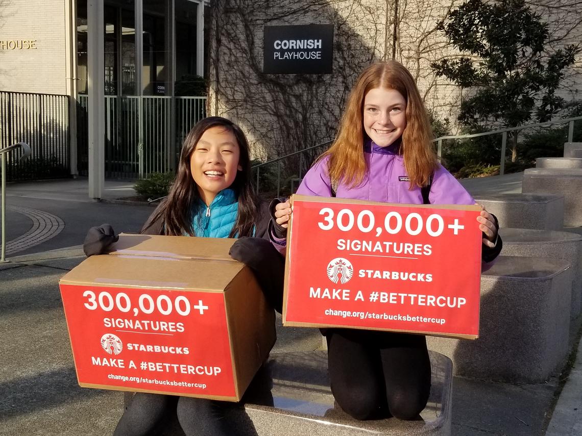 Mya Chau and Eve Helman campaign outside the Starbucks shareholder's meeting in Seattle.