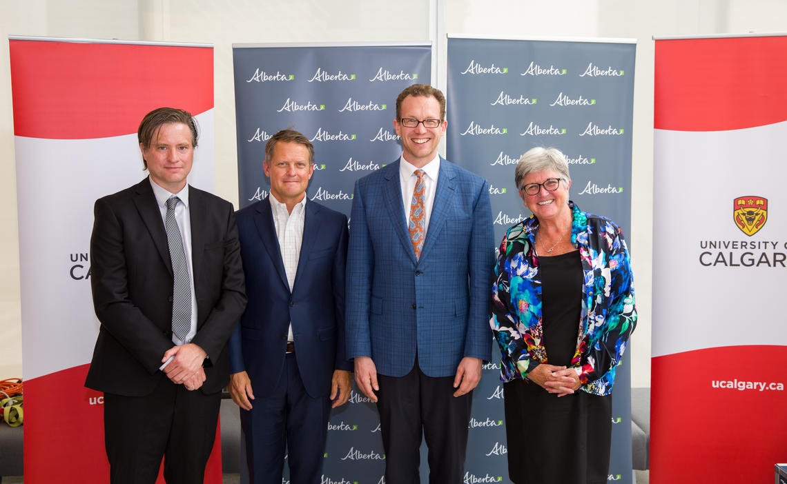 With Minister Schmidt at the announcement are, from left: Schulich School of Engineering Dean Bill Rosehart, TACT co-chair Brad Zumwalt, and University of Calgary Provost Dru Marshall. 