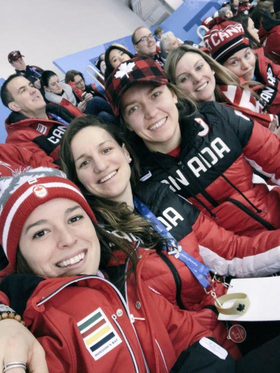 Brianne Jenner, third from left, and teammates watch a hockey game during the 2018 Pyeongchang Olympics. 