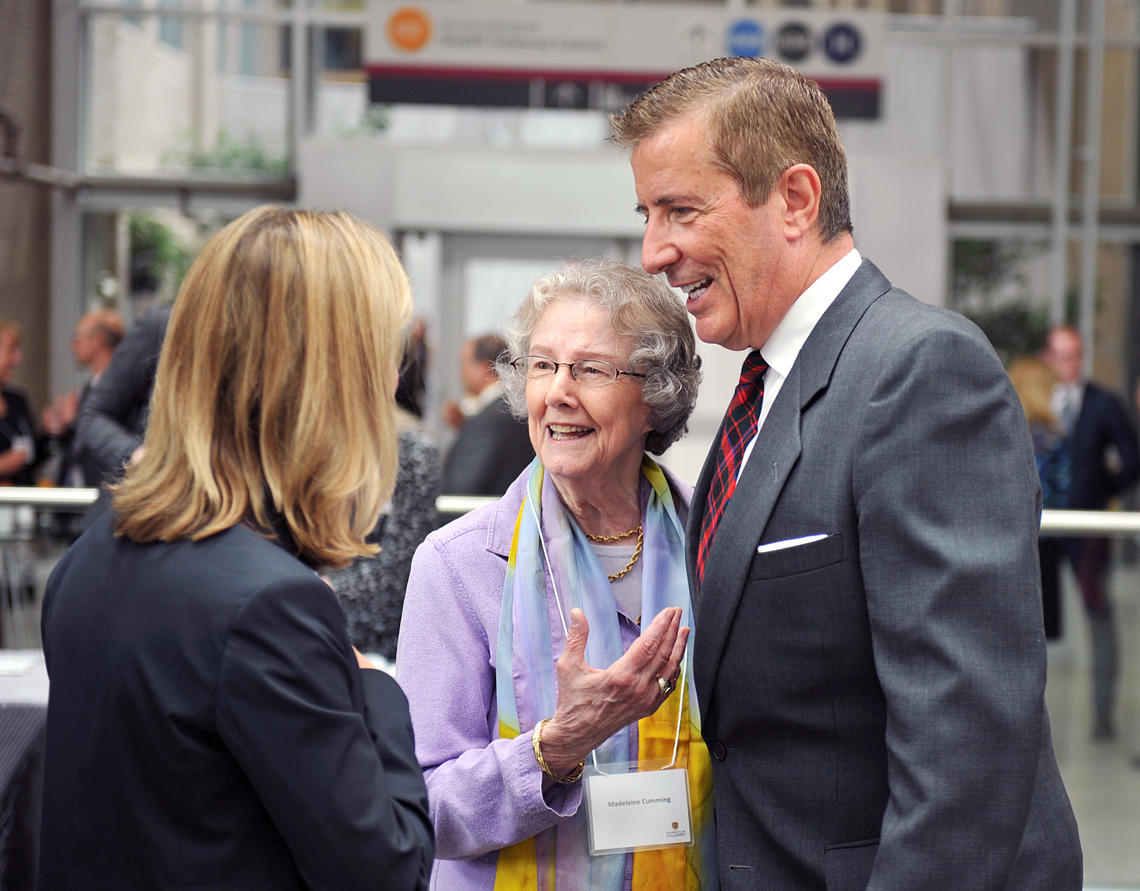 Geoffrey Cumming, right, shares a moment with his mother, Madeleine, during a 2014 event celebrating the largest philanthropic gift in the university’s history.