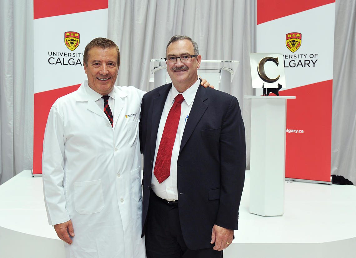 The Cumming School of Medicine is named in honour of Geoffrey Cumming, left, shown with medical school Dean Jon Meddings at the 2014 event announcing the largest donation in the University of Calgary’s history. Photos by Jaekyun Im, for the Cumming School of Medicine