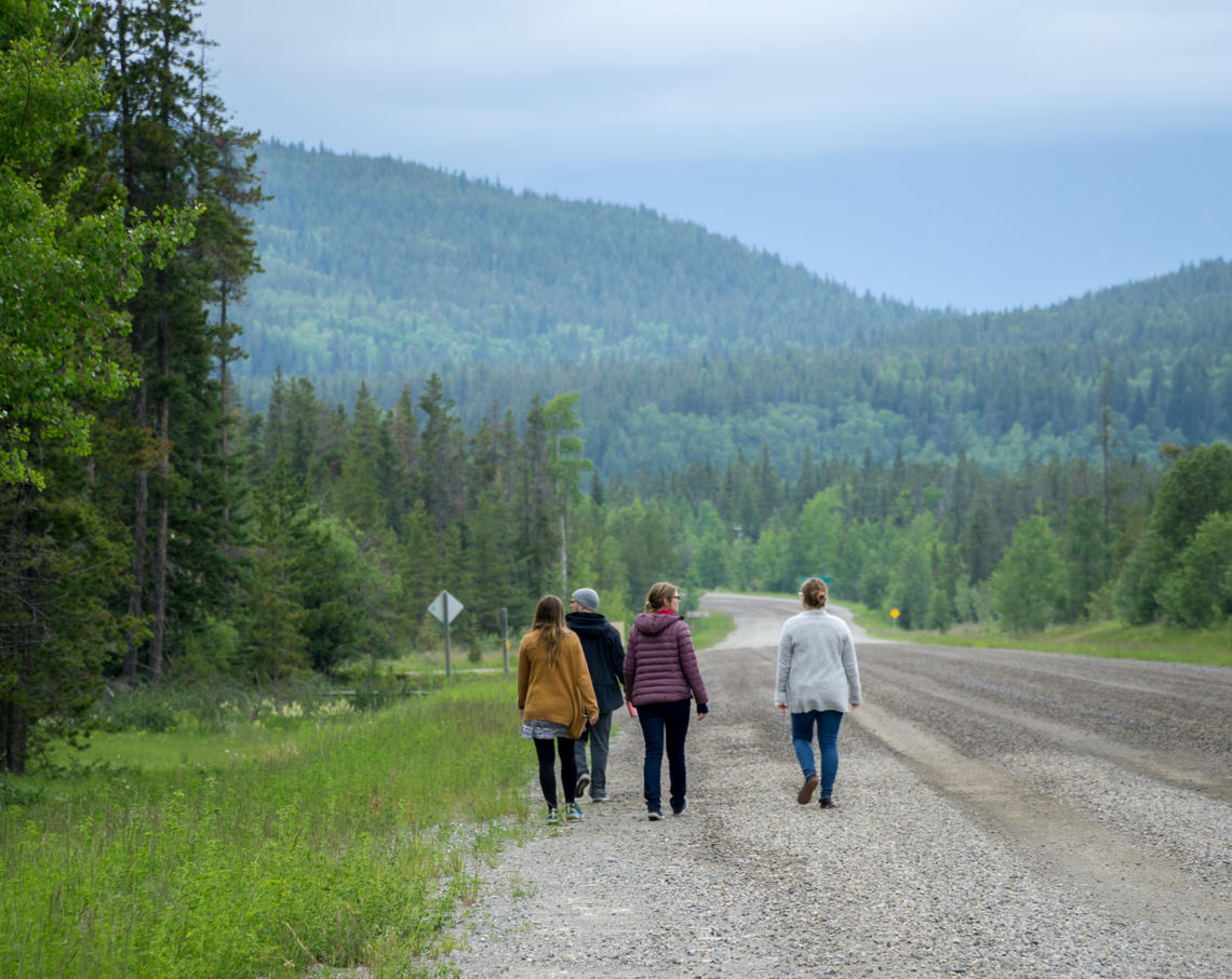 Students walk along a mountain road