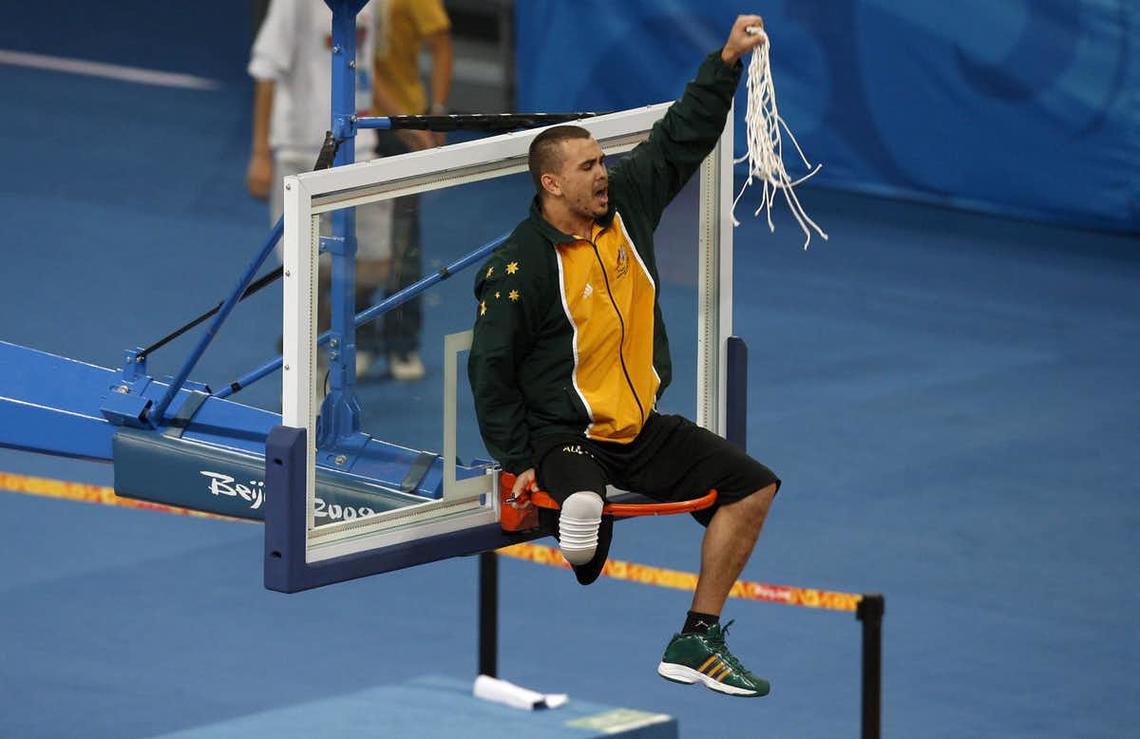 Australian wheelchair basketballer Justin Eveson celebrates winning gold at the Beijing Paralympics.
