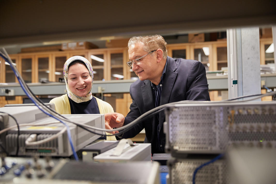 ASTech Award winner Dr. Fadhel Ghannouchi, PhD, works with a graduate student in the iRadio Lab at the Schulich School of Engineering