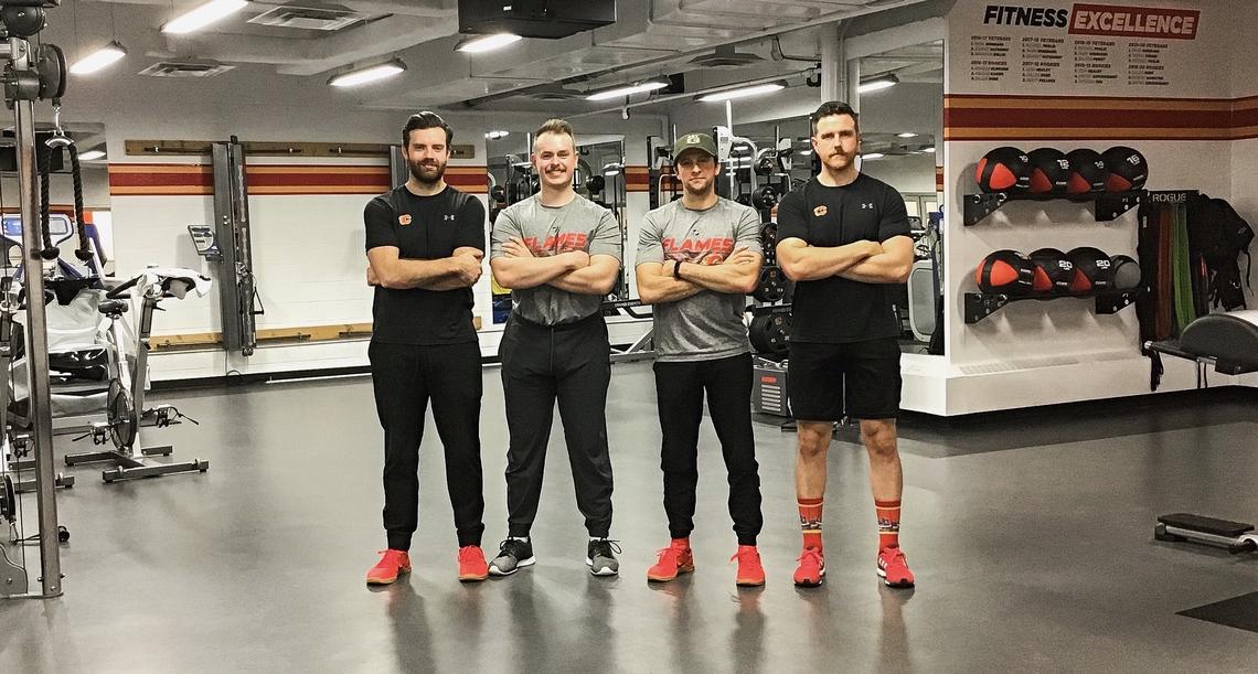 The Calgary Flames Strength and Conditioning Staff (S&C) for 2019-2020, from left: Caylin Relkoff, Daryl Chambers, Assistant S&C Alan Selby, and Head S&C Ryan Van Asten.