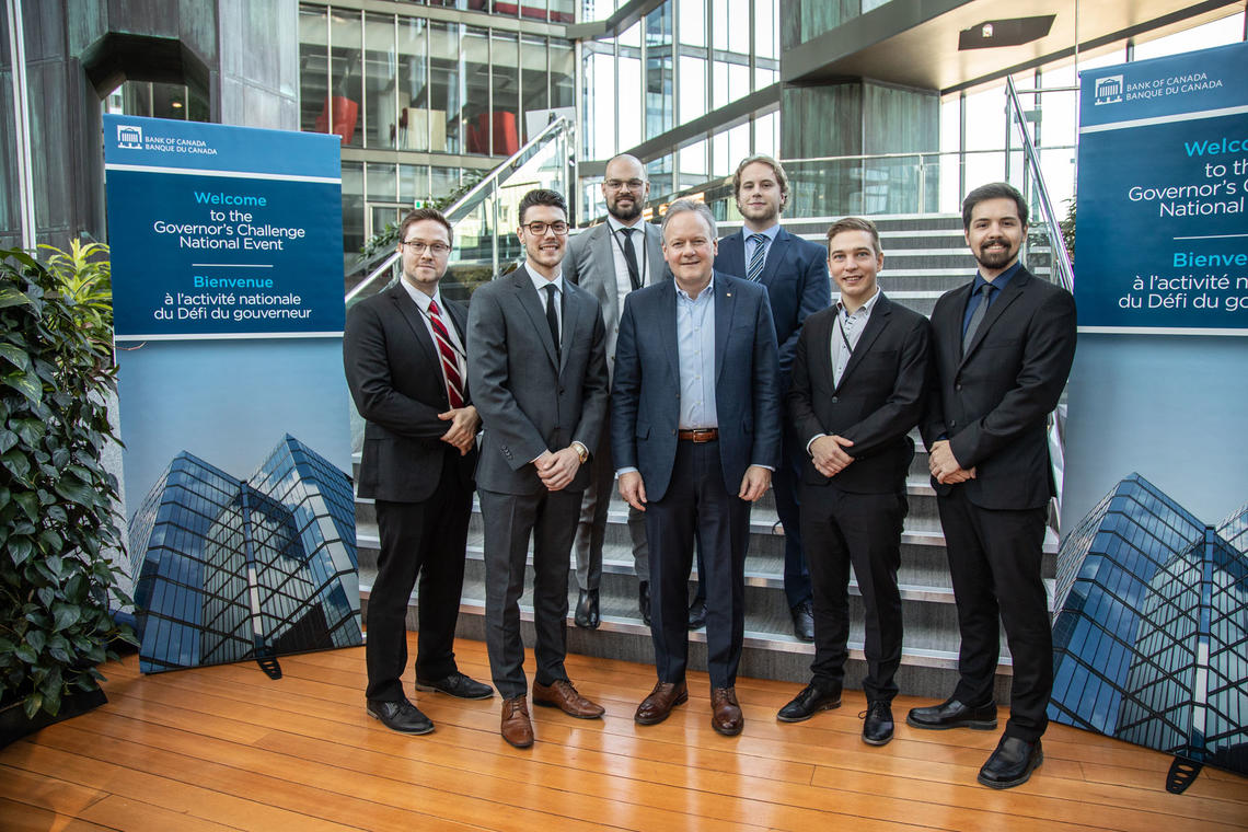 The UCalgary Team at the Bank of Canada Governor's Challenge, from left: Jacob Graham, assistant to the team coordinator; Ryan Sartori , backup presenter; Korbin Ducharme , presenter; Stephen Poloz,  former Governor of the Bank of Canada; Brandon Hodge, presenter; Tyrell Jaques , presenter; and Jordan Bartsch, presenter and team coordinator.