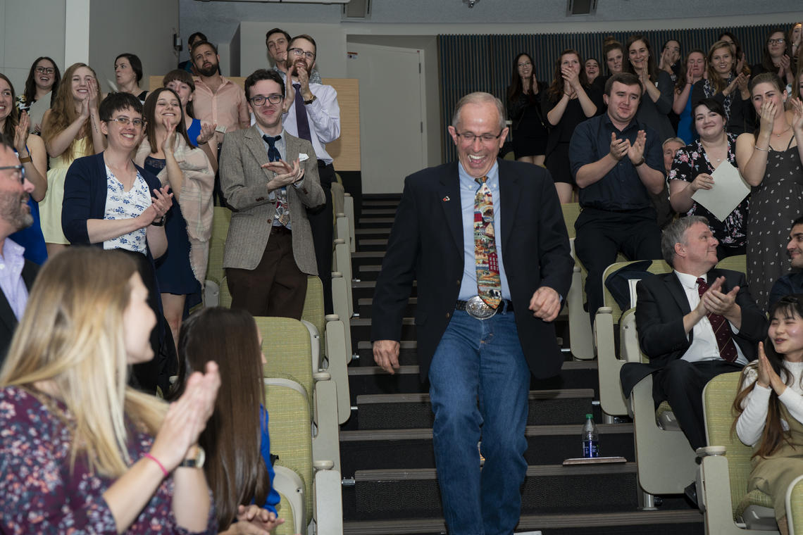 Gordon Atkins gets a standing ovation on winning the Carl J. Norden Distinguished Teaching Award in 2018.