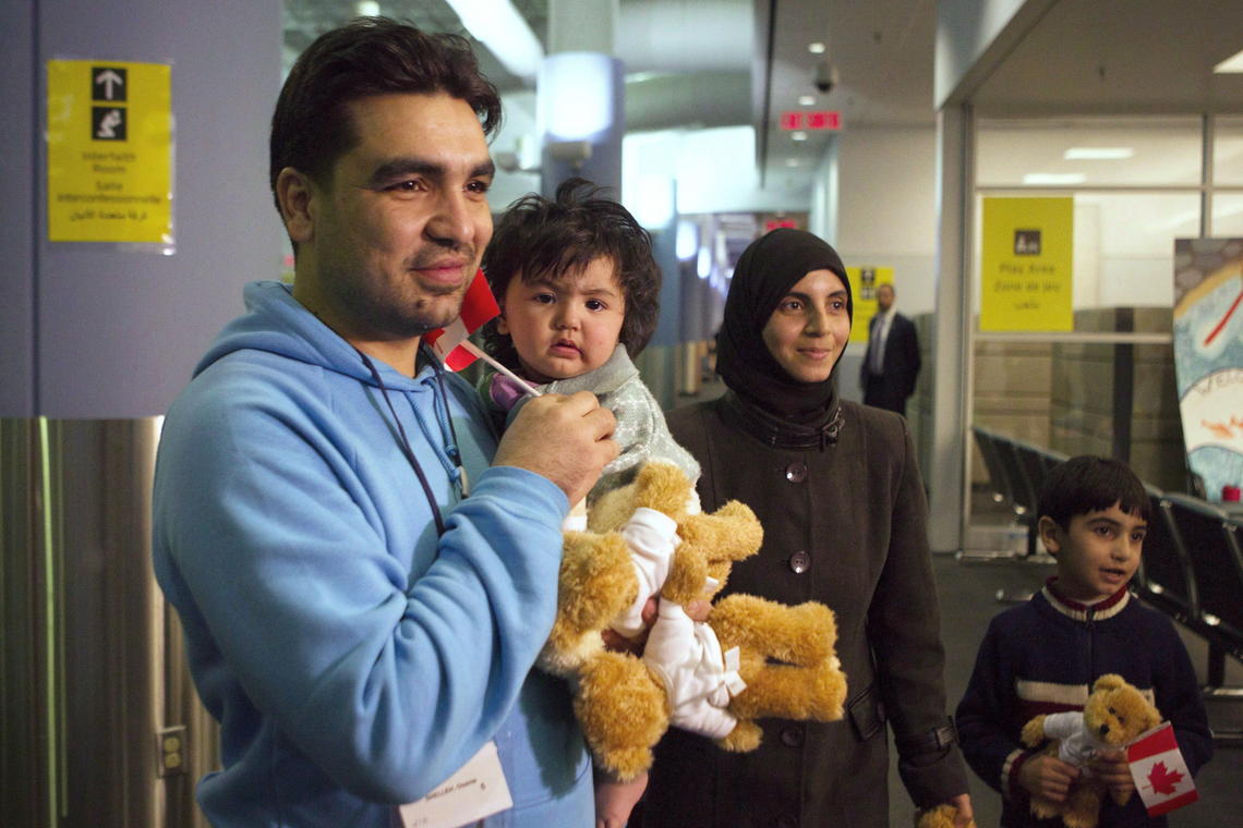 A family of Syrian refugees arrives at the Welcome Centre at Toronto’s Pearson Airport in 2015. 