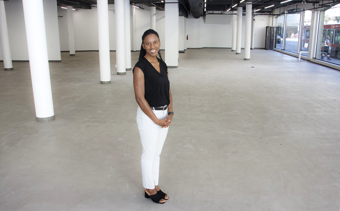 Faculty of Social Work professor Patrina Duhaney stands in an empty storefront which will be converted into a space for the Black Youth Summer Leadership program.