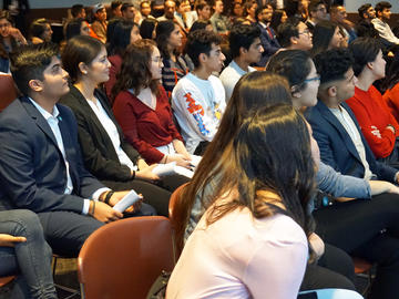 Members of the Ismaili student body watch a live stream of the event in the Dining Centre.