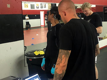 Researchers test vestibular system of fighters at Impact Boxing and Fitness.