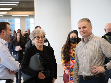 Provost Dr. Penny Werthner (centre) chats with colleagues