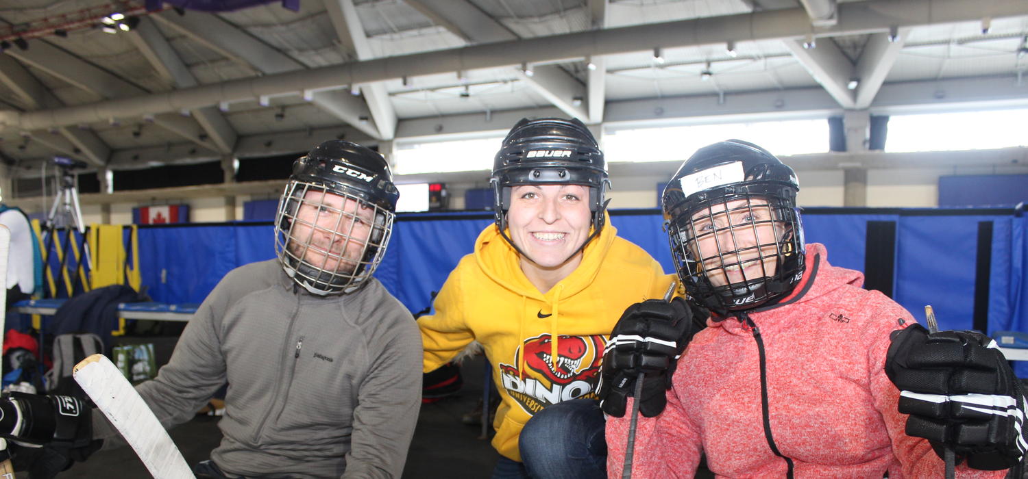 A team from the Sport for Brains program at the Elsass Institute in Denmark visit the Olympic Oval ice to learn how to play sledge hockey from UCalgary student Elysa Sandron, centre. Rasmus Hjorth Petersen, left, and Camilla Voigt plan to take their new passion for the sport back to Denmark and introduce the activity to youth with cerebral palsy. Alberta Children’s Hospital Research Institute photos