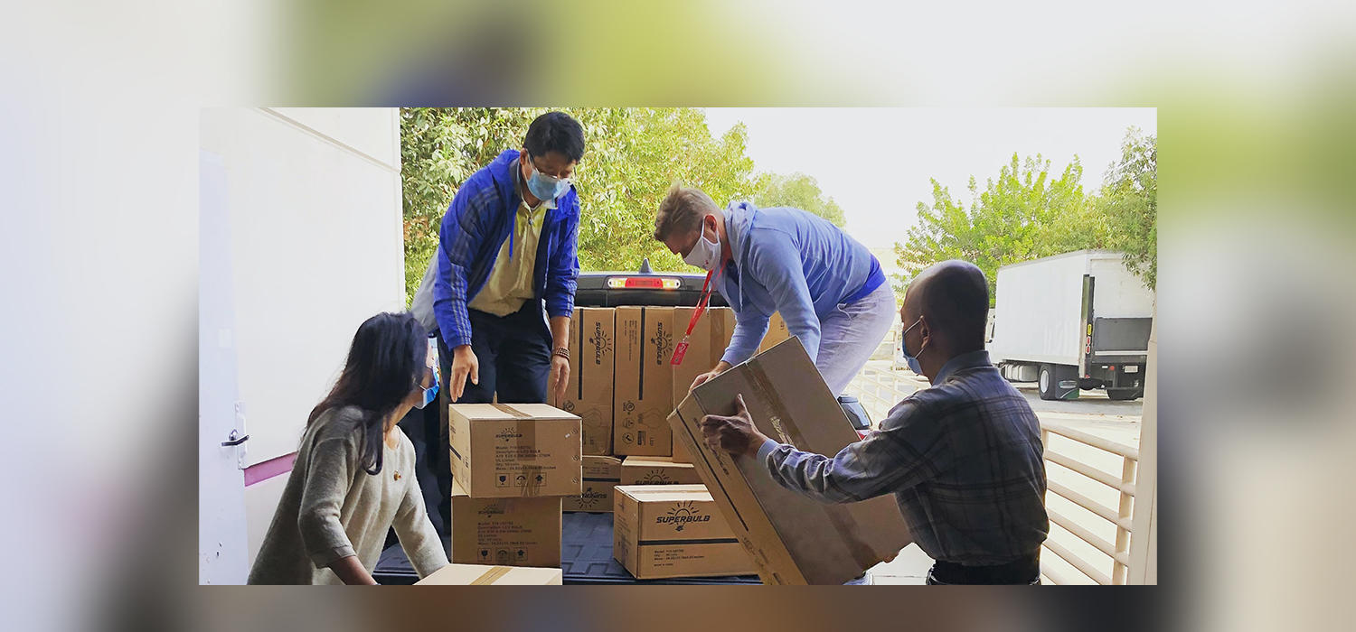 People volunteering loading a truck