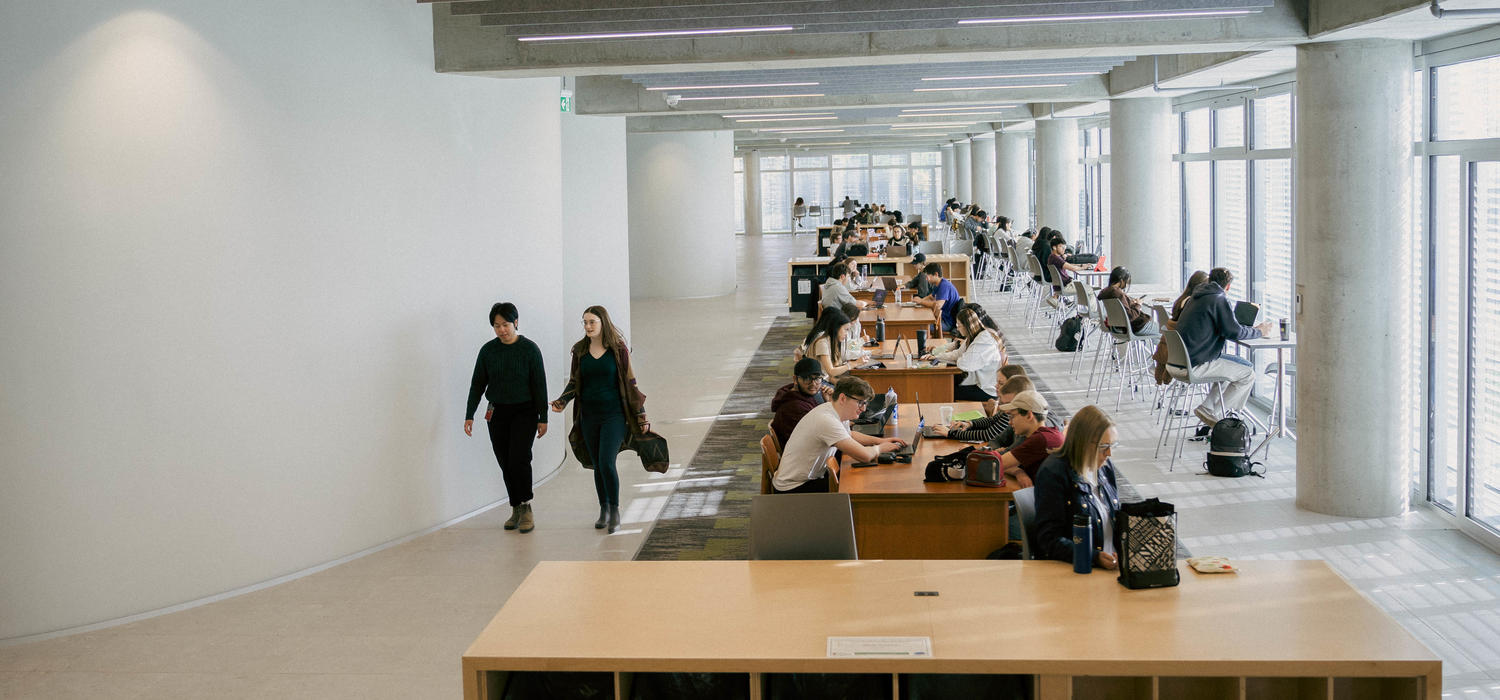 Rows of mid-century tables on the third floor of Hunter Student Commons were saved and restored from the former MacKimmie Block, just one way the past is honoured as part of the new building. 