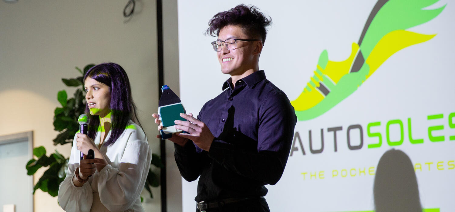 Nasid Islam, left, and Steven Ma present the Autosoles concept to the Liftoff! competition.