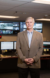 Brian Sembo, chief of campus security, in the Security Operations Centre, where recorded data from more than 1,100 high-resolution digital cameras across campus is monitored. Photo by Riley Brandt, University of Calgary