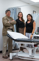 Nick Mohtadi, left, led a clinical trial with Dana Hunter, centre, research assistant, and Denise Chan, research co-ordinator, investigating anterior cruciate ligament (ACL) reconstruction for youth at high risk of knee reinjury. Photo by Riley Brandt, University of Calgary