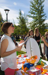 Group of people at a table of brochures