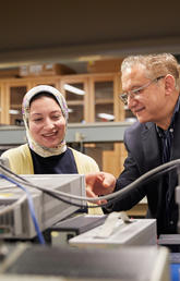 ASTech Award winner Dr. Fadhel Ghannouchi, PhD, works with a graduate student in the iRadio Lab at the Schulich School of Engineering