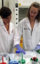 Dr. Jennifer Thompson, PhD, works with a student in her lab