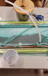 Half a small wind turbine blade being made by infusing resin through a glass fibre layup in a mould made at UCalgary.  This work was done by Dr. Wood’s summer student, Deep Patel to provide the background knowledge – and maybe blade moulds – to support the Uganda project.