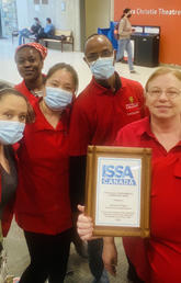 caretaking staff with plaque