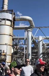 Students from the REDEVELOP program gather in front of the Jumping Pound Power Plant