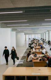 Rows of mid-century tables on the third floor of Hunter Student Commons were saved and restored from the former MacKimmie Block, just one way the past is honoured as part of the new building. 