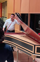 Justin Luchinski demos the harpsichord to students in the piano studio class, Sep. 2022