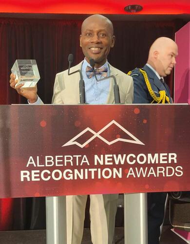 Gideon Christian receives the Alberta Newcomer Award