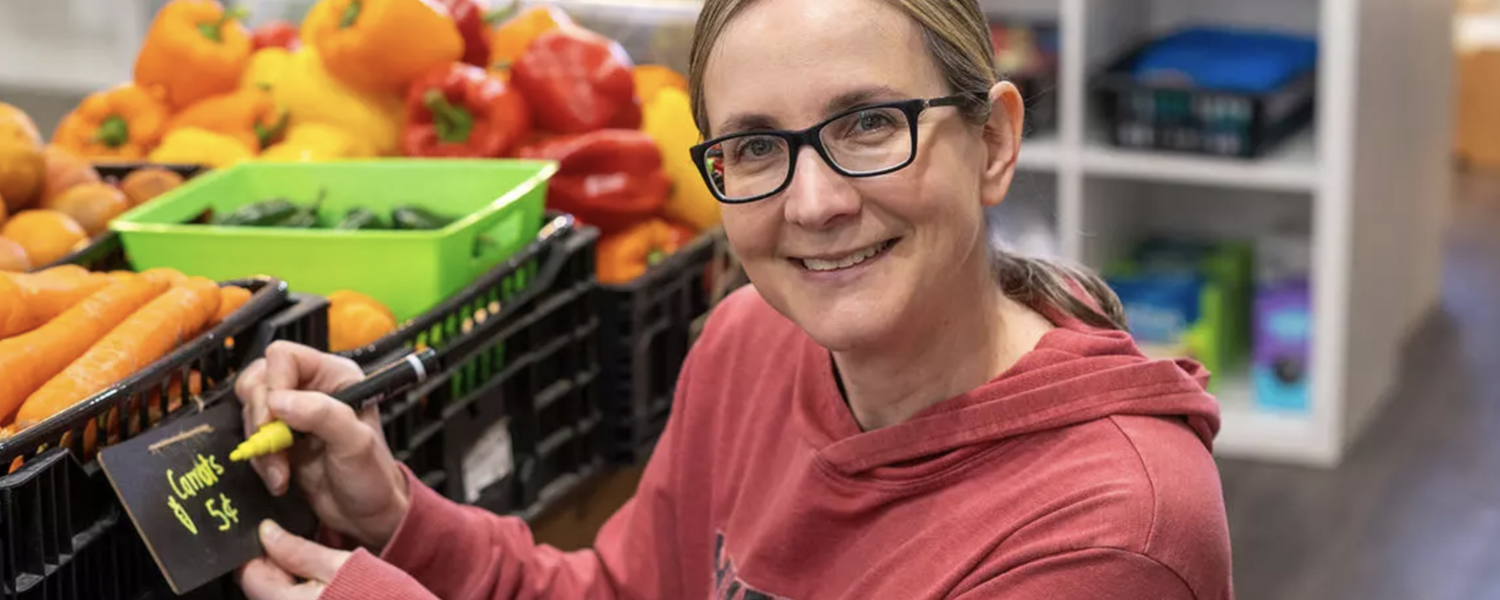 Pam Farrell pricing vegetables at GROW Community Food Literacy Centre