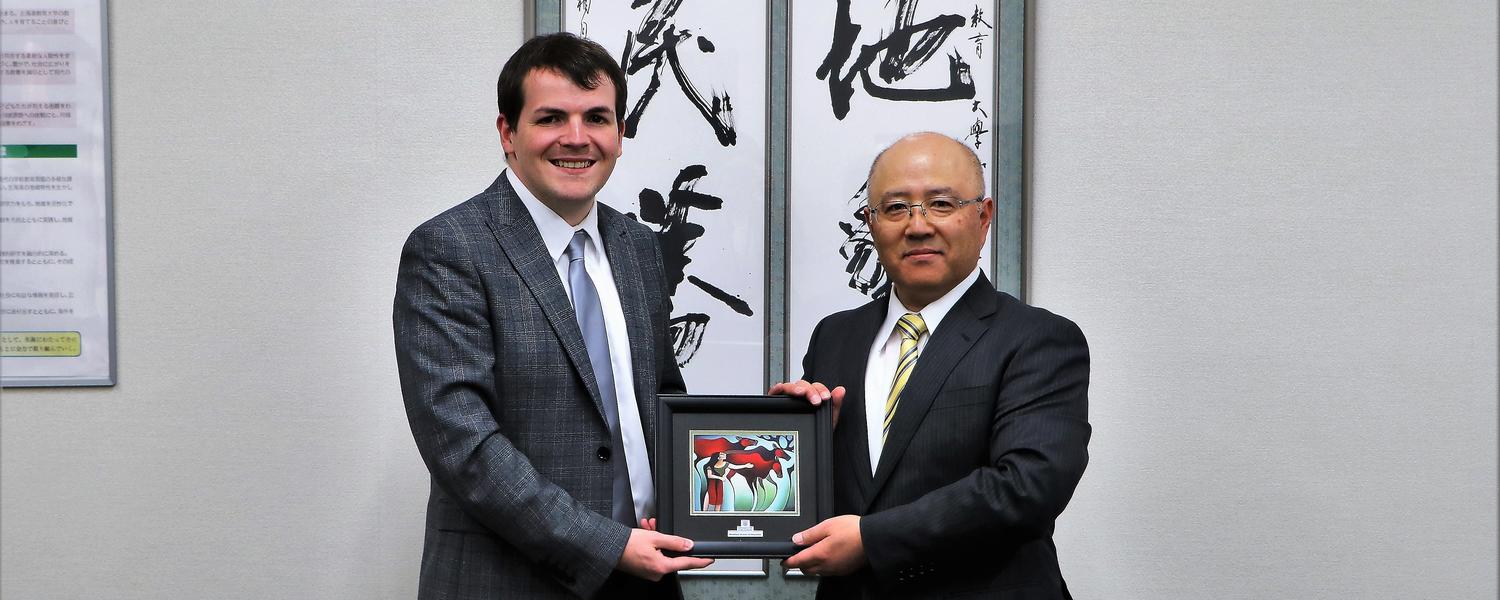 Mike Holden presents a gift to Hokkaido Chair