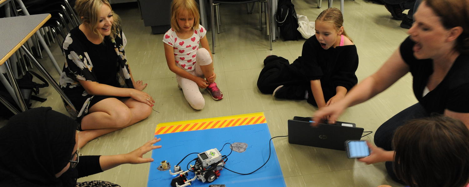 student teachers share robotics with children