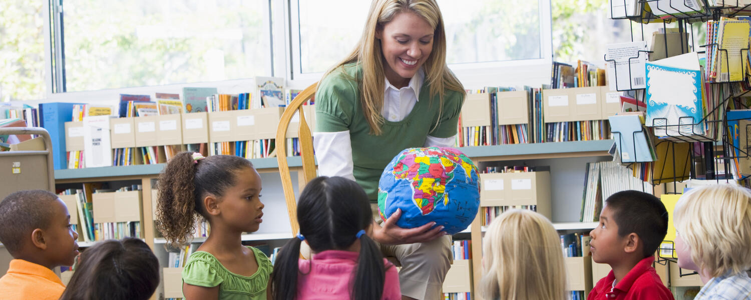 Teacher with globe