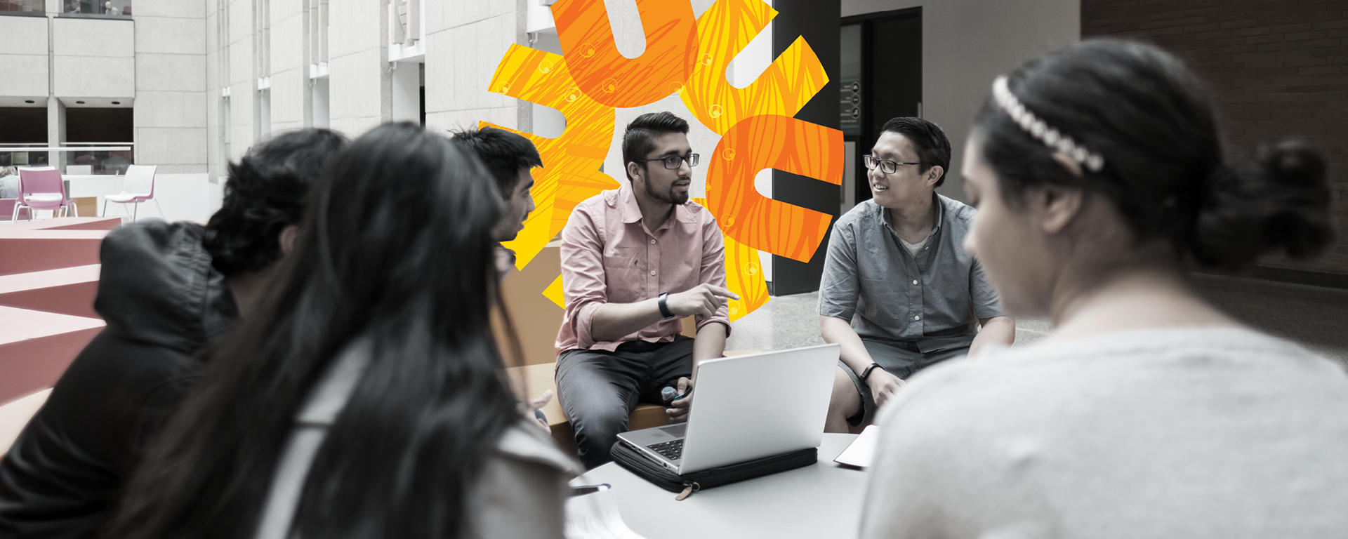 Man at laptop talking to peers