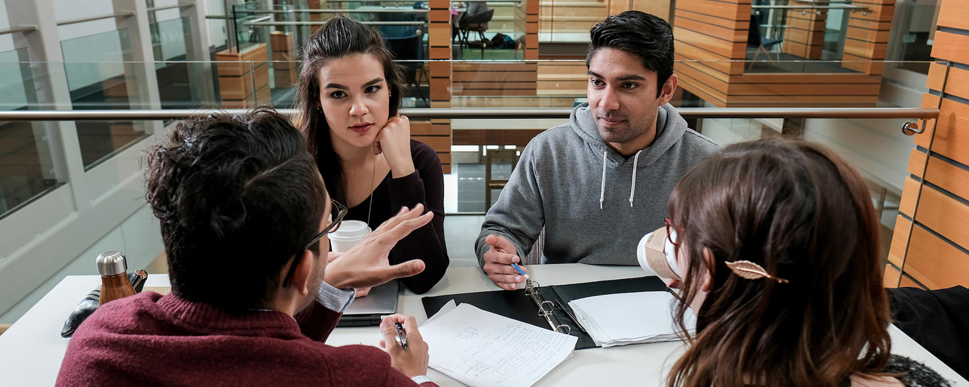 Four students having a discussion.