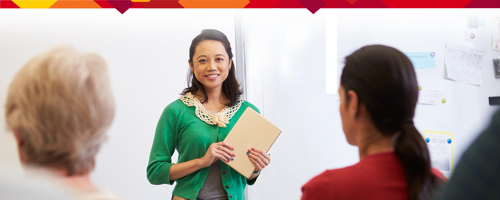 Woman standing in front of classroom