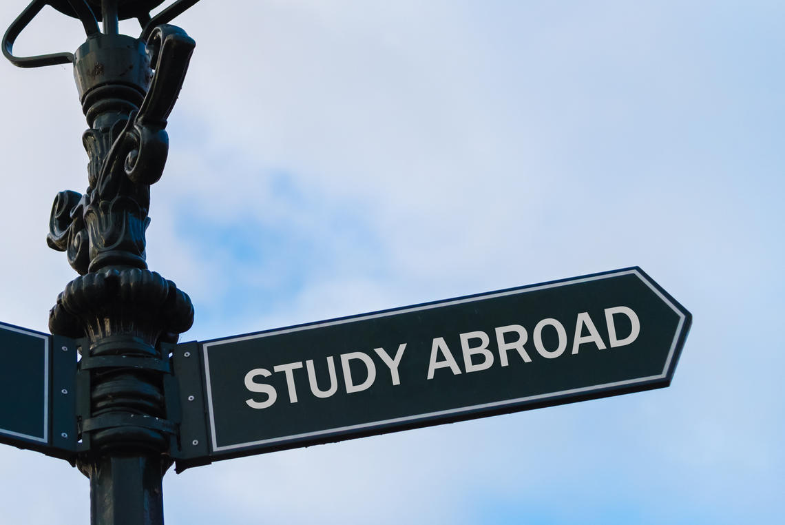 Student Funding and Resources Lamp post and study abroad street sign