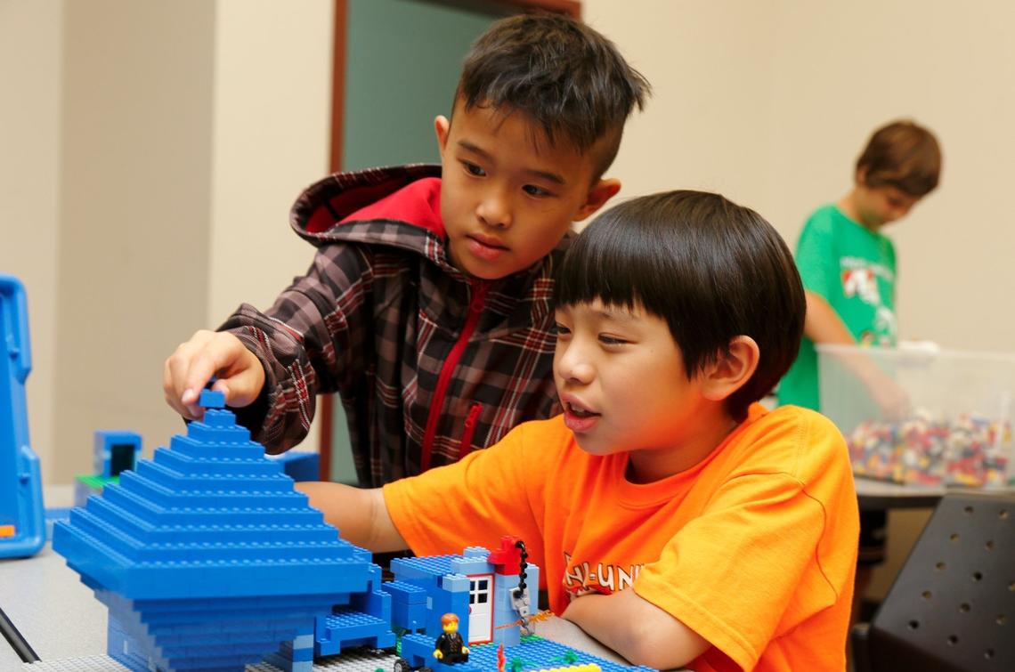 Immigrant Services Calgary's Mosaic AfterSchool Program Two children work on a 3D puzzle