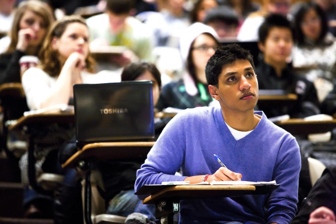 A university student listens in a lecture