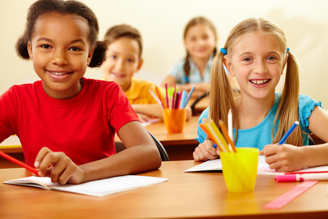 Werklund Reading Intervention Program Two children sit at a desk in a classroom