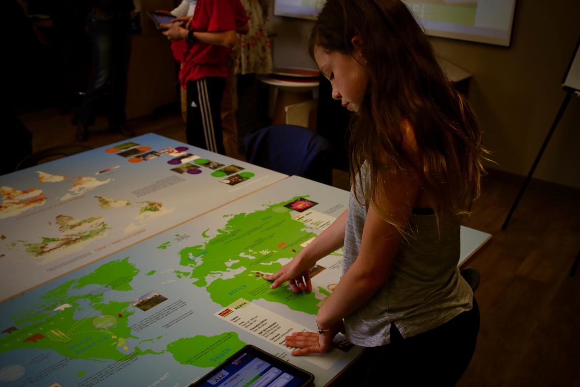 Student Points to coffee on a map