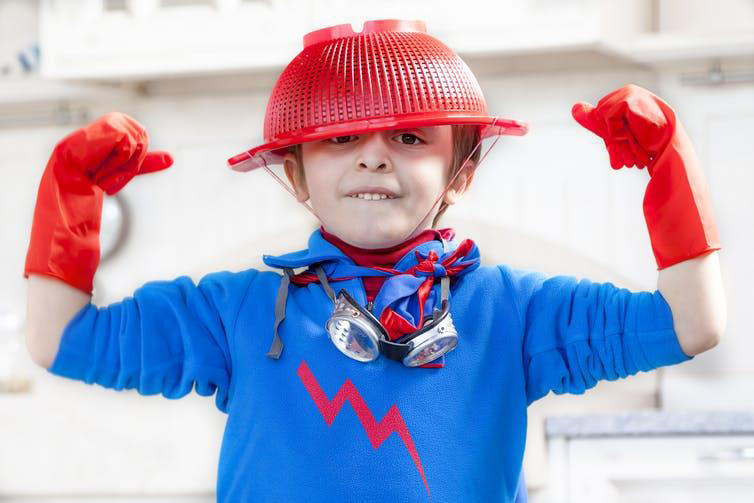 Child dressed up as superhero