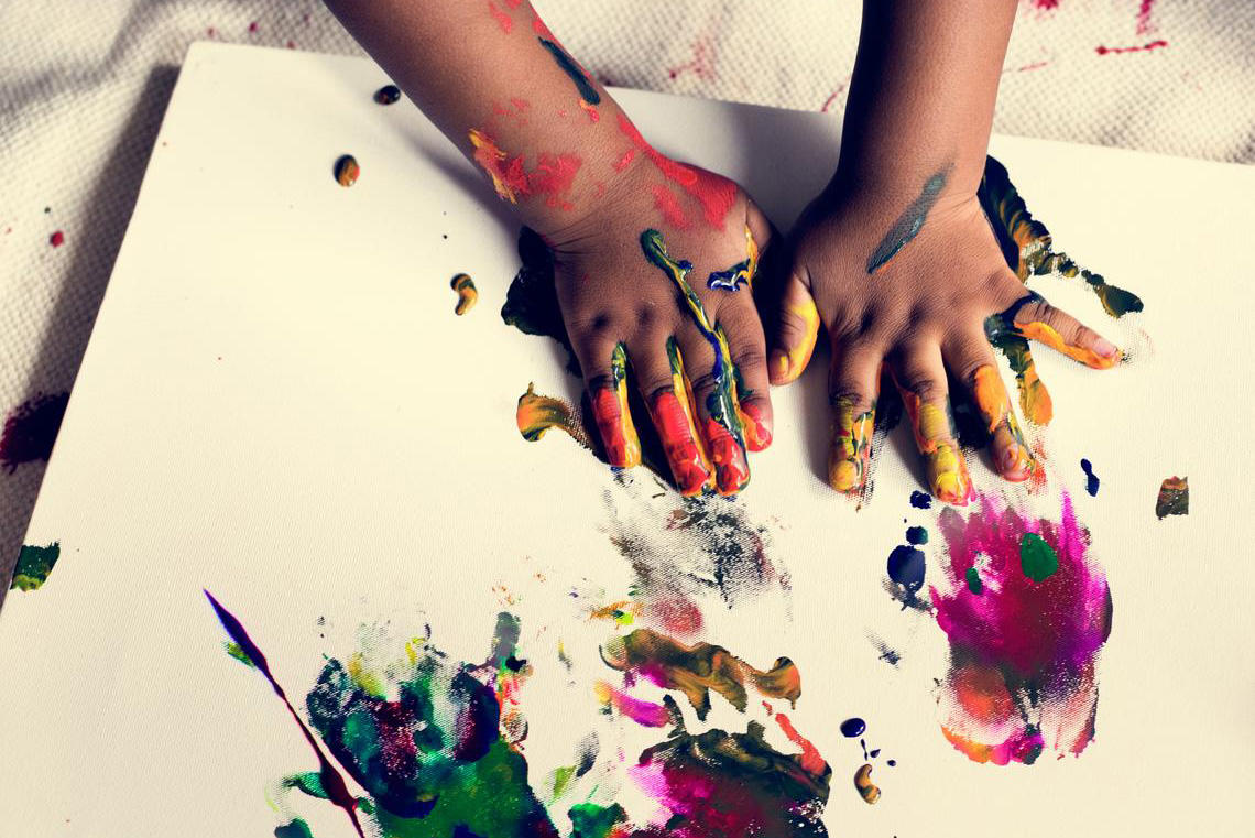 Child hands painting