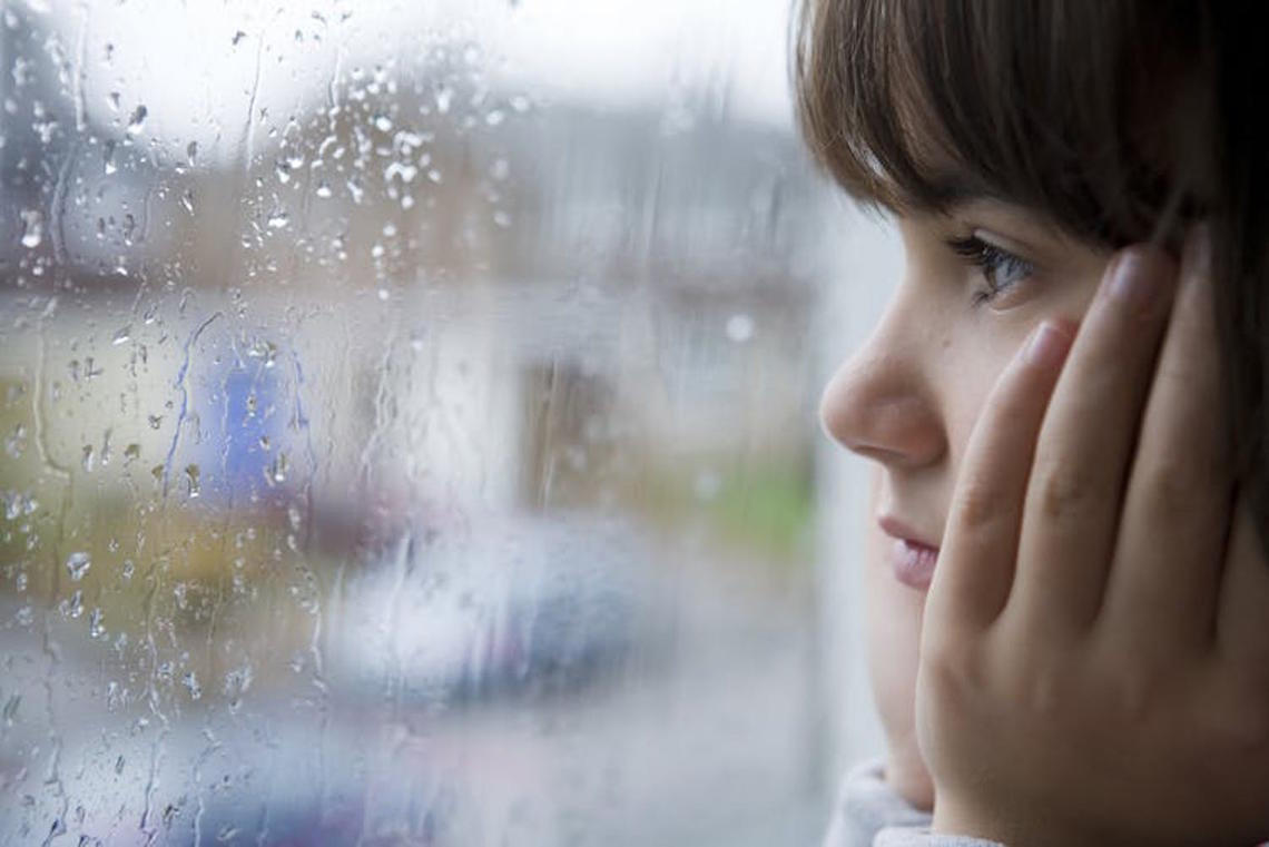 Child looking out window