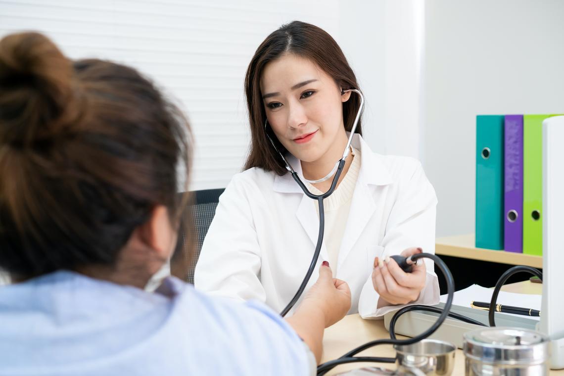 Doctor taking blood pressure