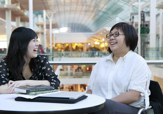 Mentor and mentee share a laugh